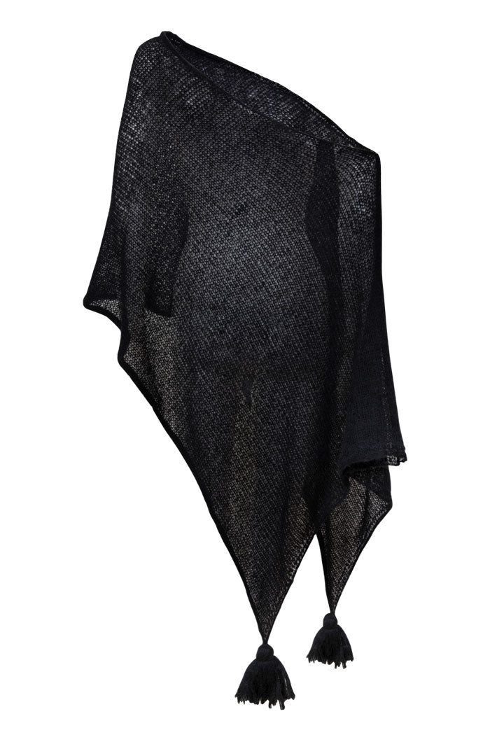 One of our bestsellers is the black poncho, just a simple beautifully made poncho to throw on top of every outfit.